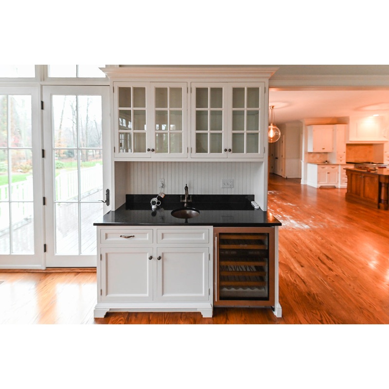 Traditional White Wet Bar Area with Black Granite Countertops
