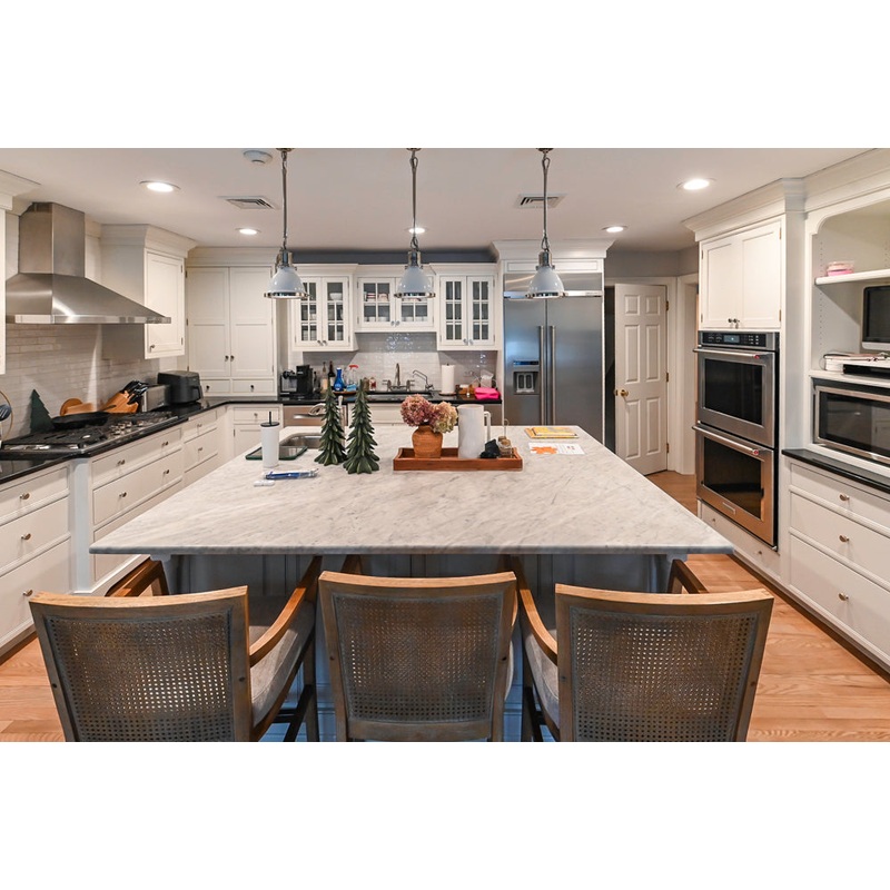 Traditional White Kitchen with Marble Top Island and Appliances