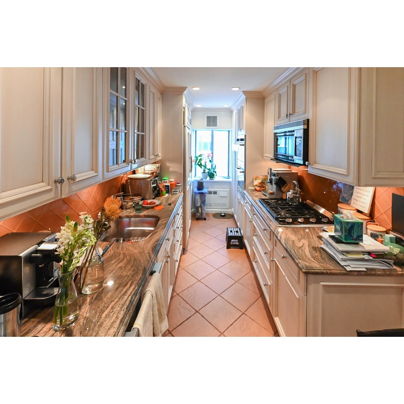 Wood-Mode Wonder: Traditional Light Cream Kitchen with Granite Countertops