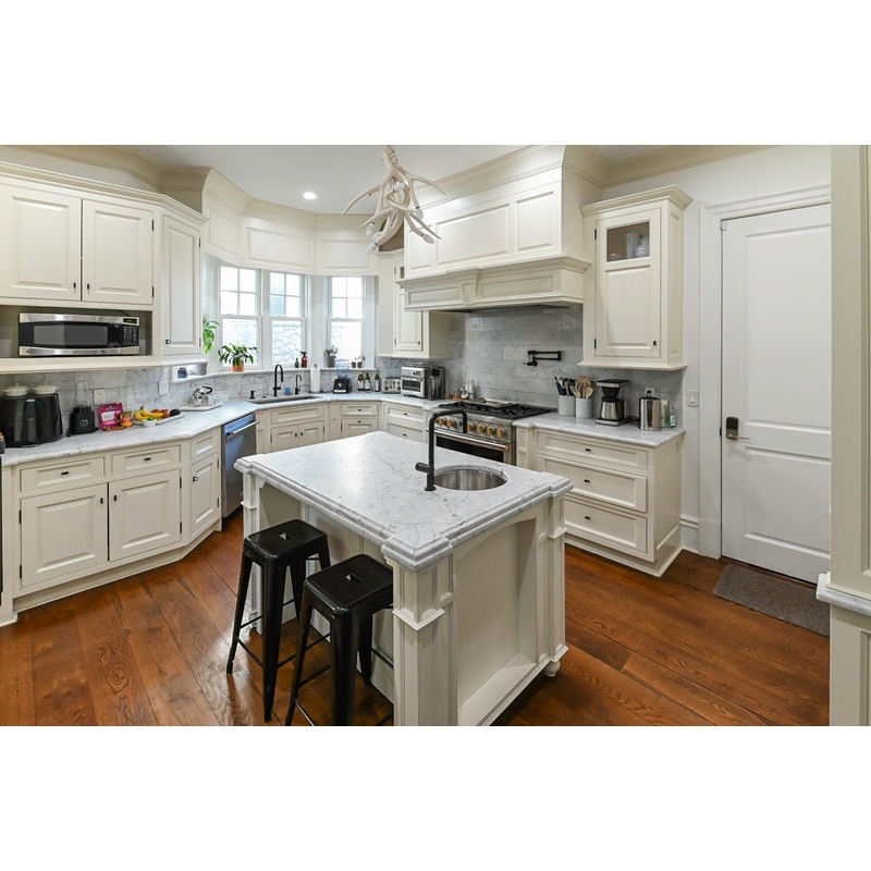 Traditional Creamy White Kitchen with Island, Marble Countertops and Appliances