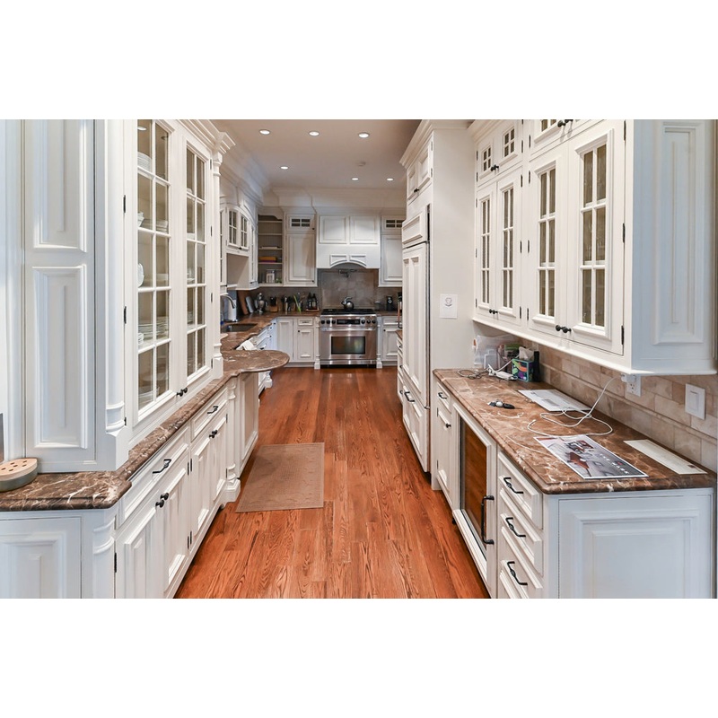 Quakermaid Traditional White Kitchen with Marble Countertops and Luxe Appliances