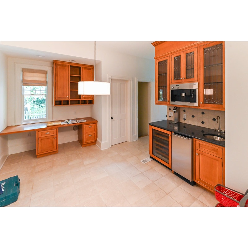 Traditional Wooden Butler’s Pantry with Sub-Zero Wine Cooler & Desk Area